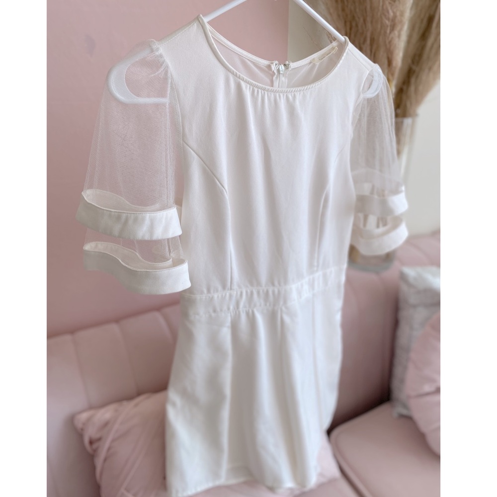 White romper size small. Only worn once